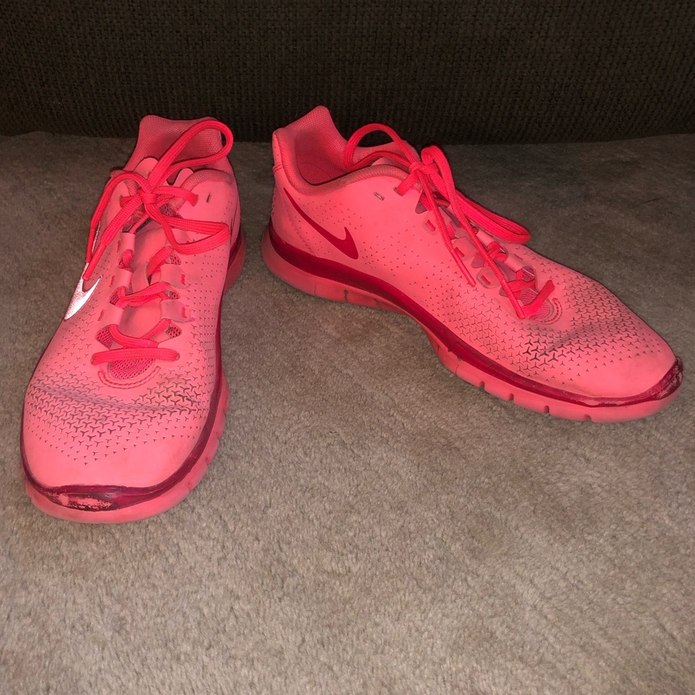 Neon pink nike shoes.